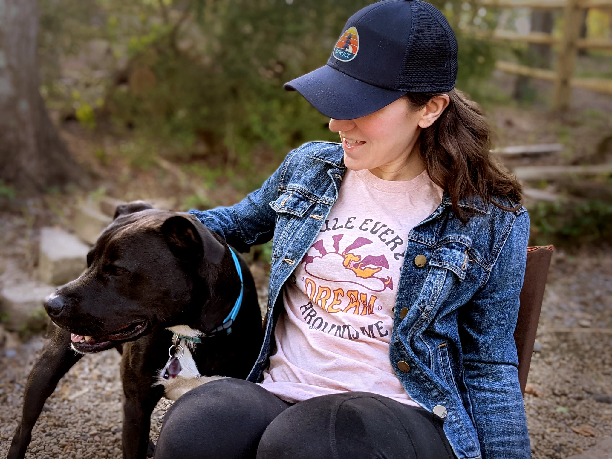 Woman wearing dog 'DREAM' t-shirt with her dog 