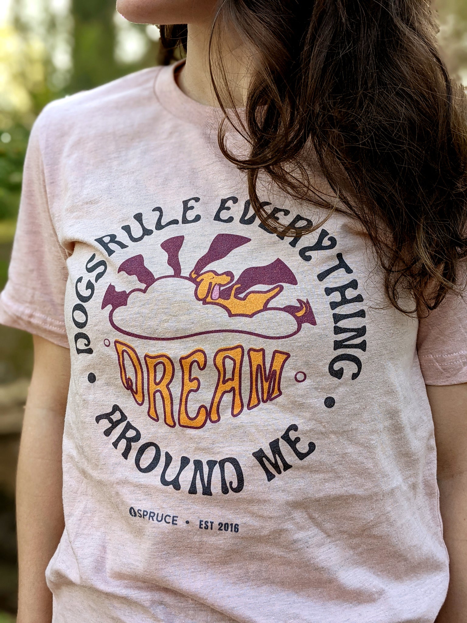 Woman wearing dog 'DREAM' t-shirt with her dog 