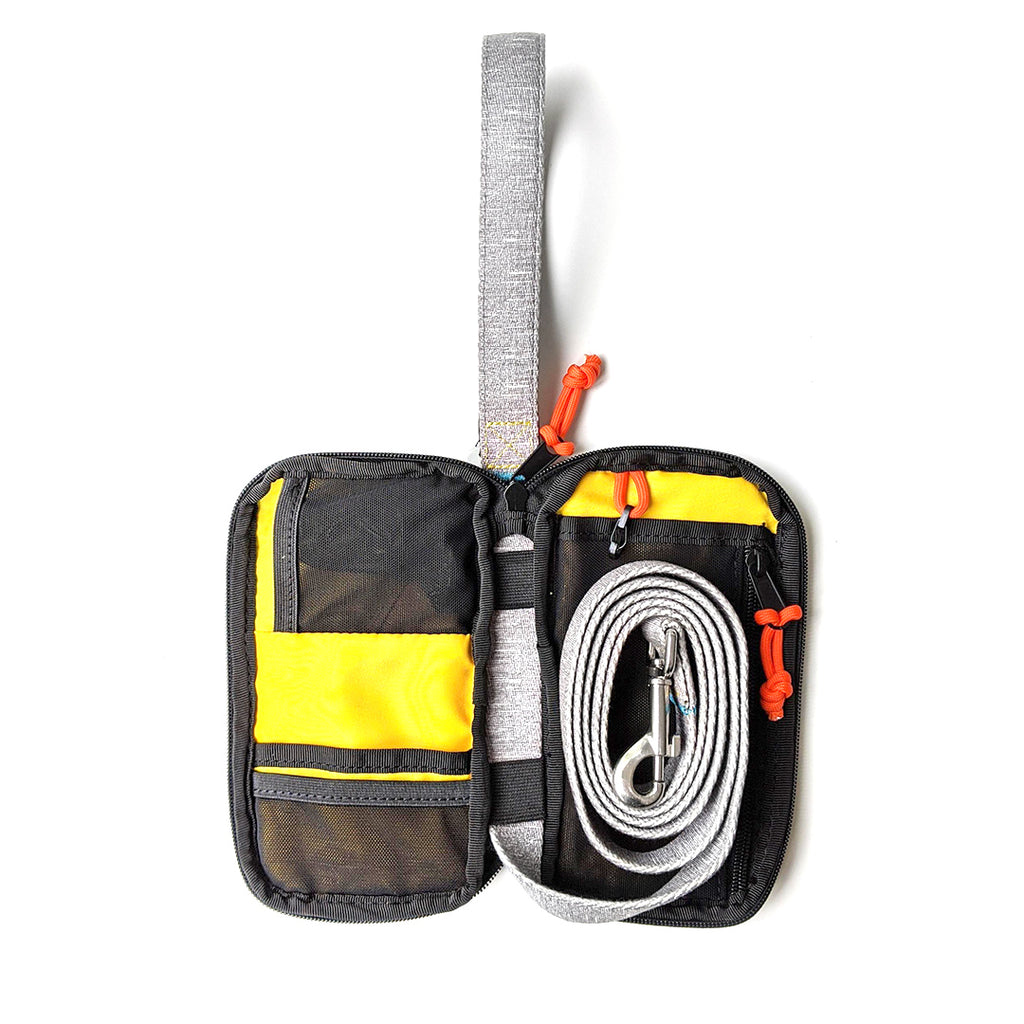 Spruce Grab & Go Dog Leash Bag opened with leash rolled up inside for storage